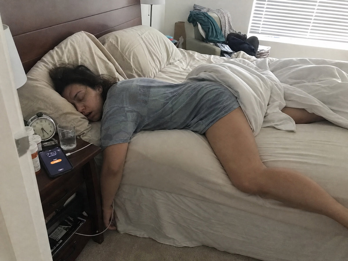 Woman asleep through her phone alarm